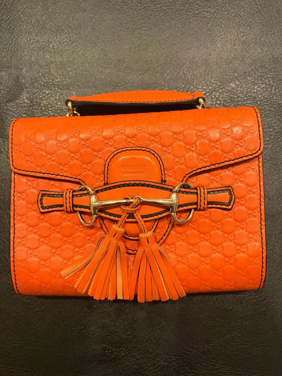 Gucci Handbags - Vintage Gucci Orange Leather Monogrammed/Emblam Mini Bag with Horsebit Tassels